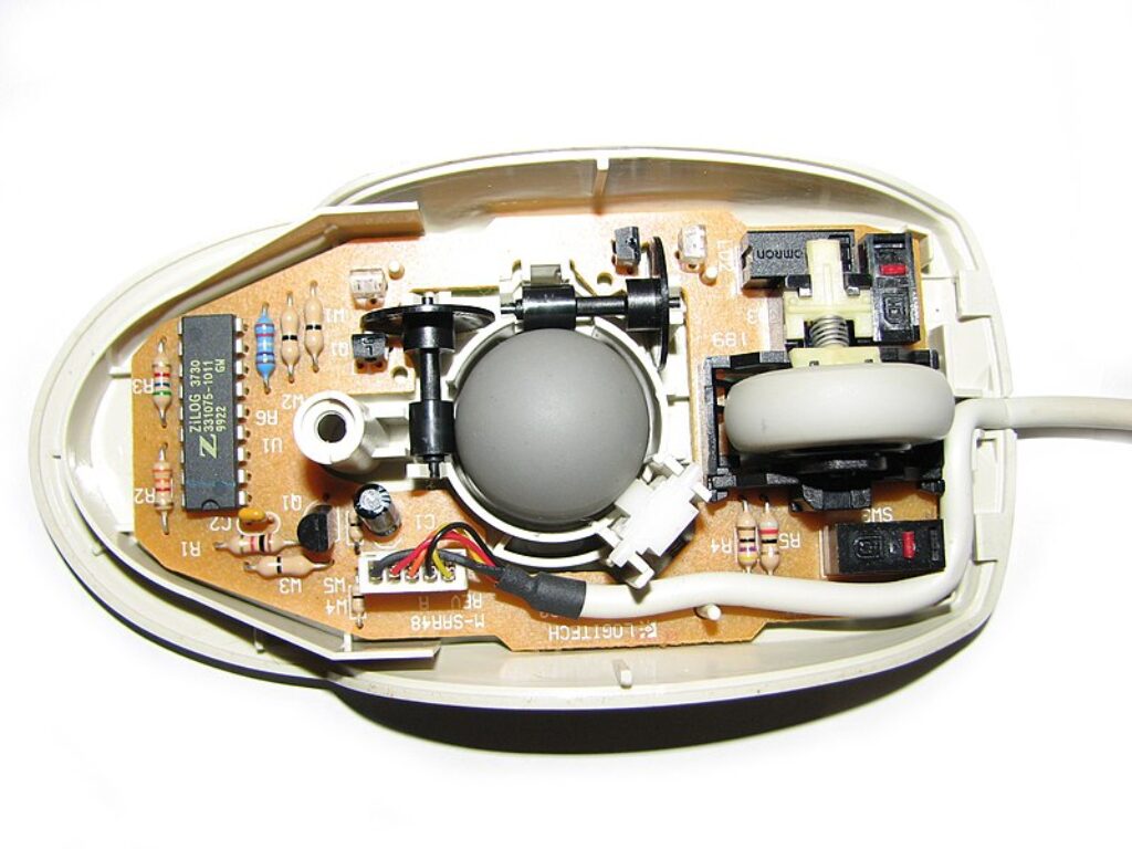 Old mechanical mouse with the bottom half removed.